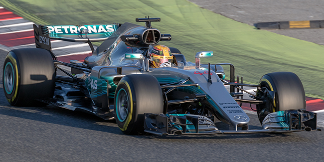 man driving a car on a racetrack